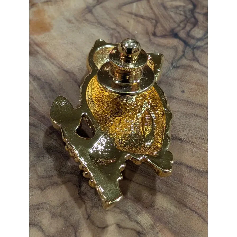 Avon gold tone owl pin back, with a large faux pearl body 1995